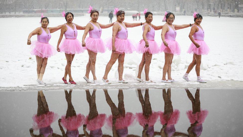 Swimmers in pink tutus