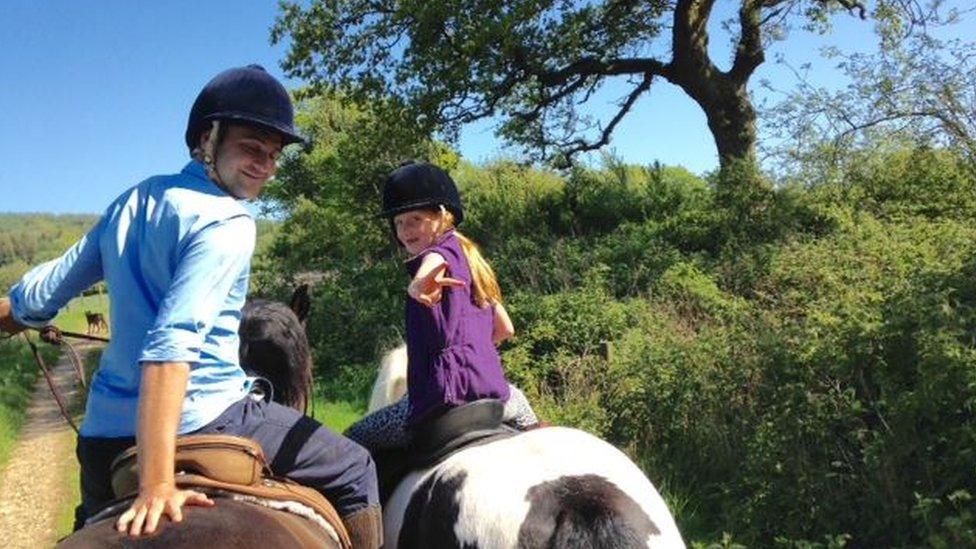 Iris horse riding with her dad