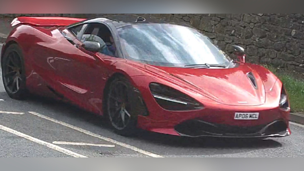 A red McLaren 720S supercar