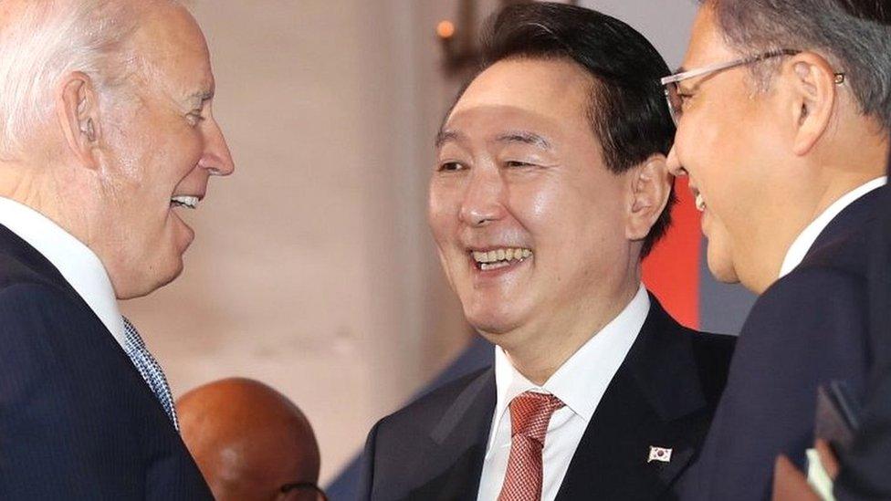 South Korean President Yoon Suk-yeol (C) talks with US President Joe Biden (L) after attending the seventh replenishment conference of the Geneva-based Global Fund to Fight Aids, Tuberculosis and Malaria in New York, New York, USA, on 21 September 2022