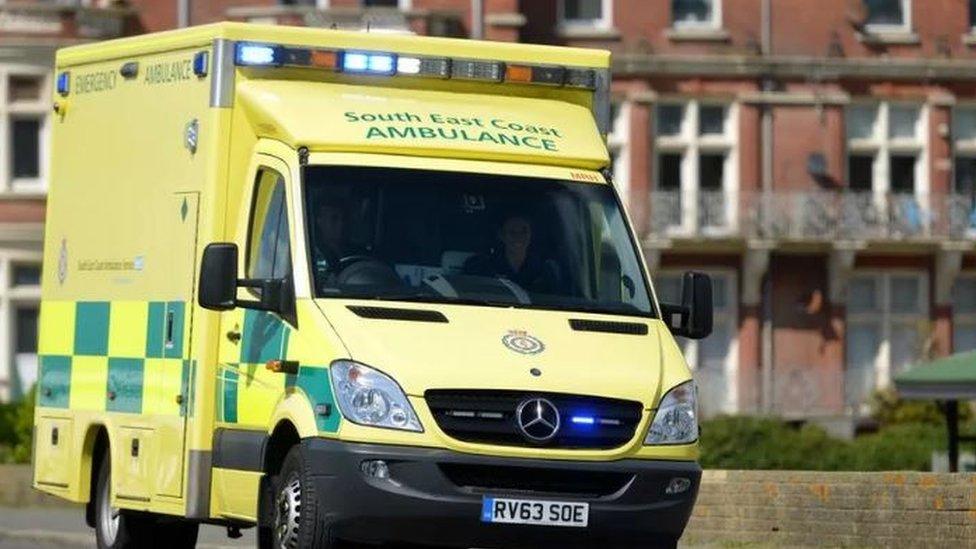 A South East Coast ambulance, with a firework display in the background