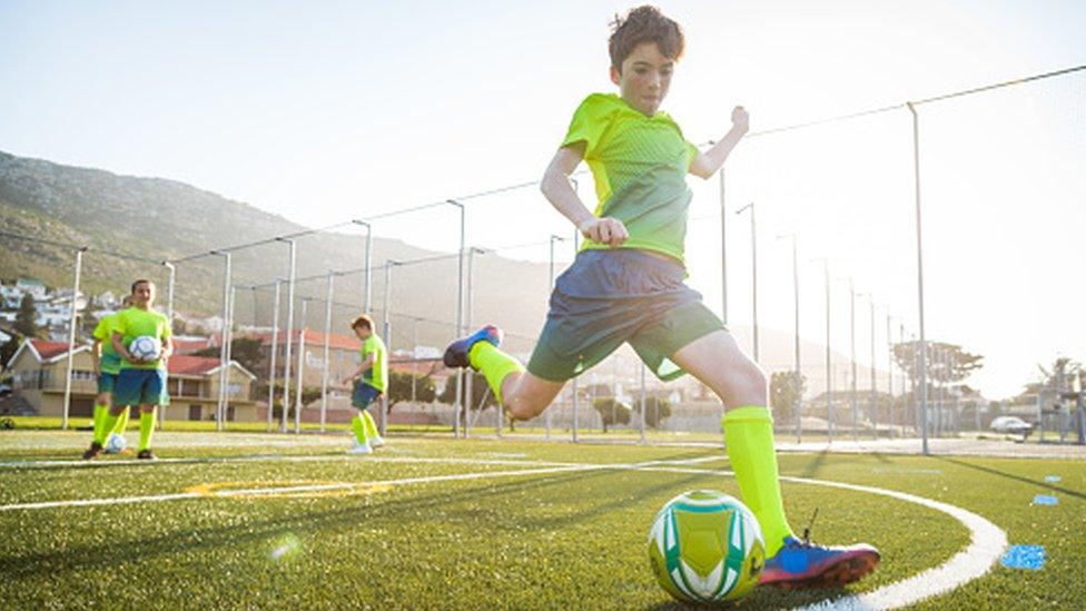 boy playing football