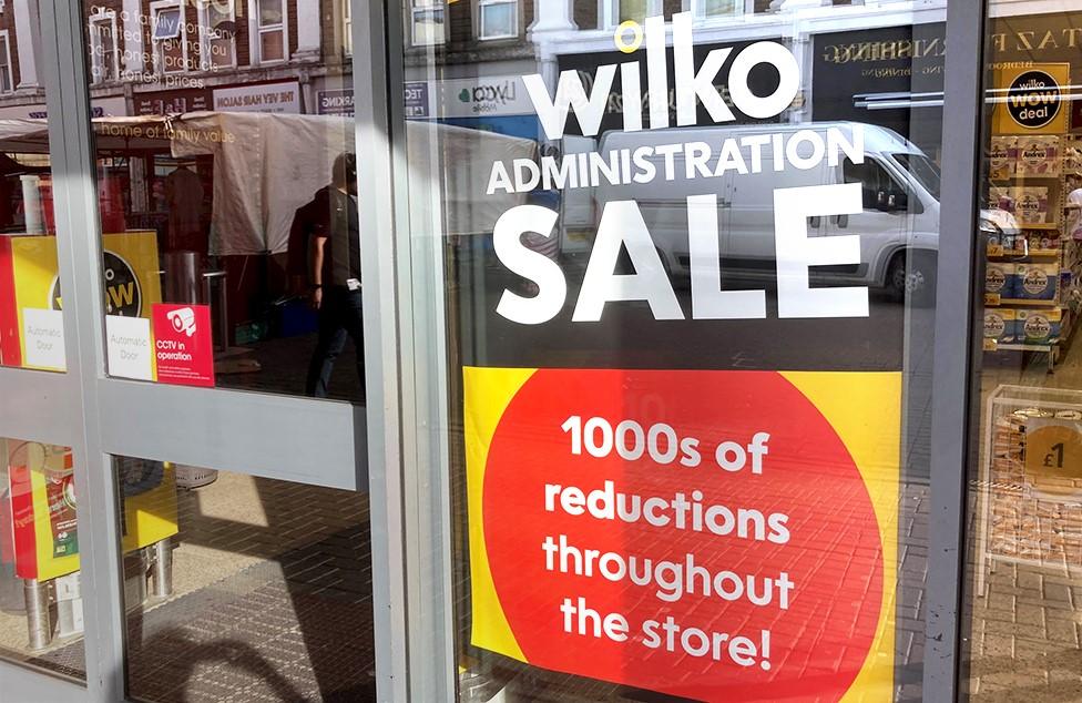 Wilk administration sale sign in window