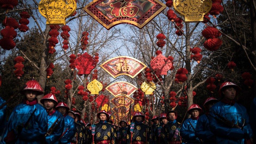 Chinese performers dressed in traditional costumes attend a rehearsal of a re-enactment of a Qing dynasty (1636-1912) imperial sacrifice ritual to worship the Earth, on the eve of the Chinese Lunar New Year