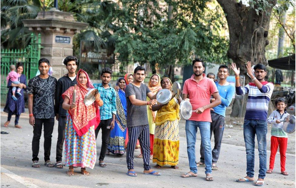 Groups of people came out onto the streets in many cities and towns, clapping and clanging vessels