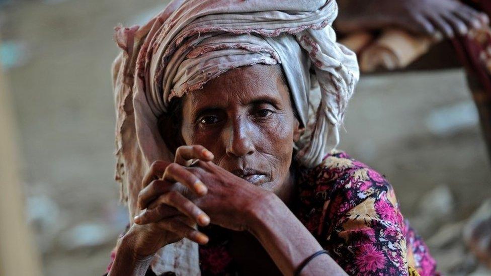 Muslim Rohingya people sit on the floor inside the Bawdupha Internally Displaced Persons (IDP) camp located on the outskirts of Sittwe, capital of Myanmar's western Rakhine state on October 30, 2012.