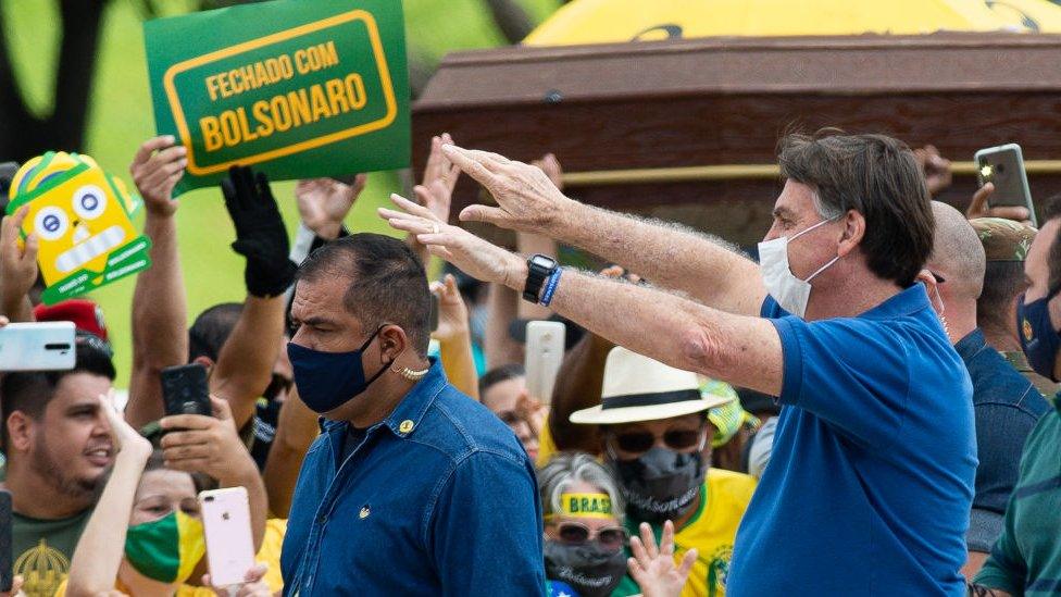 Bolsonaro waves at crowd