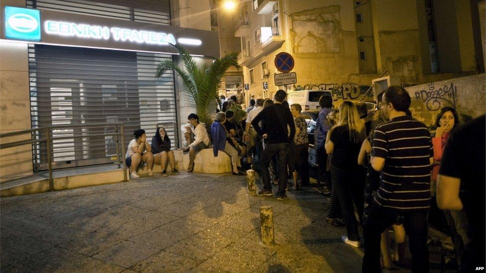 Greeks queue at an Athens ATM