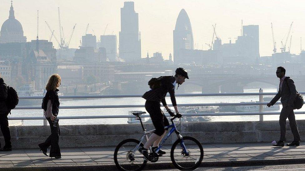 Commuters walking across Waterloo Bridge during the morning rush hour,