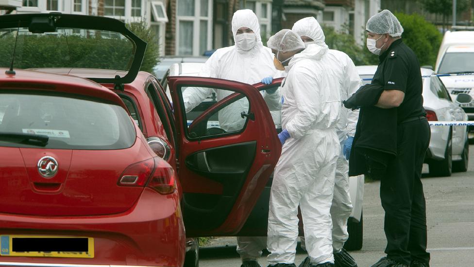 Police searching a car in Luton