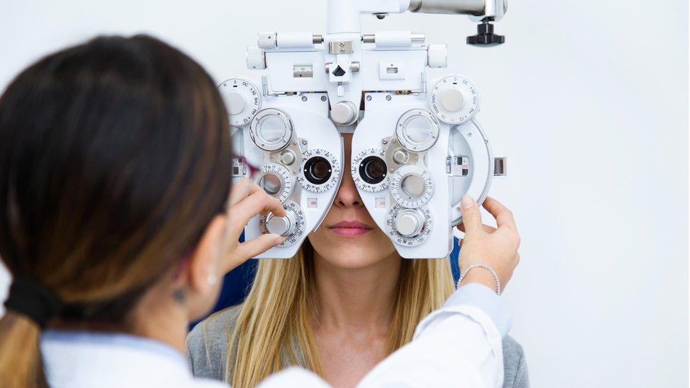 A woman getting an eye test