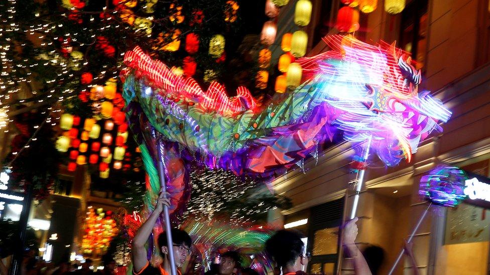 Performers take part in a dragon dance decorated with LED lights to celebrate the upcoming Mid-Autumn Festival in Hong Kong, China September 14, 2016.