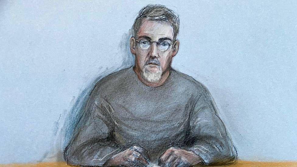 A sketch drawing of a man wearing a grey jumper, with grey hair, a beard and glasses.