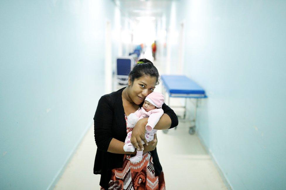 Carmen Jimenez, 33, a Venezuelan from Bolivar state, holds her four-day-old baby Amalia at a maternity hospital in Boa Vista, Roraima state, Brazil, 21 August 2018