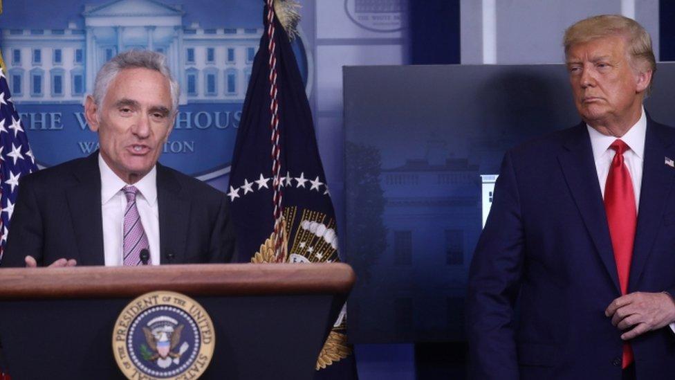 President Donald Trump listens as Dr Scott Atlas speaks to reporters at the White House, September 2020