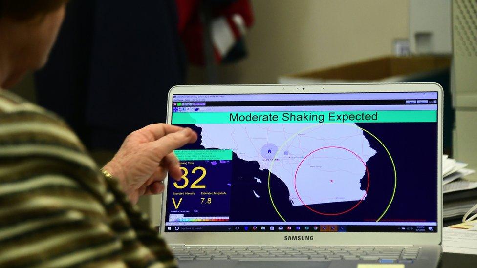 A computer screen showing an interface with the ShakeAlert warning system. A message says 'moderate shaking expected'