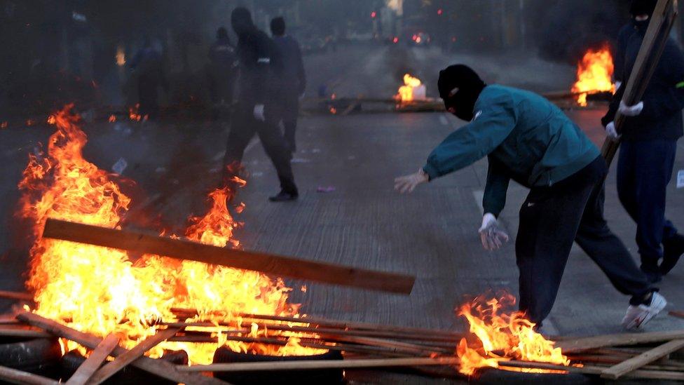 Demonstrators block a street during a strike against the national pension system in Santiago, Chile, November 4, 2016.