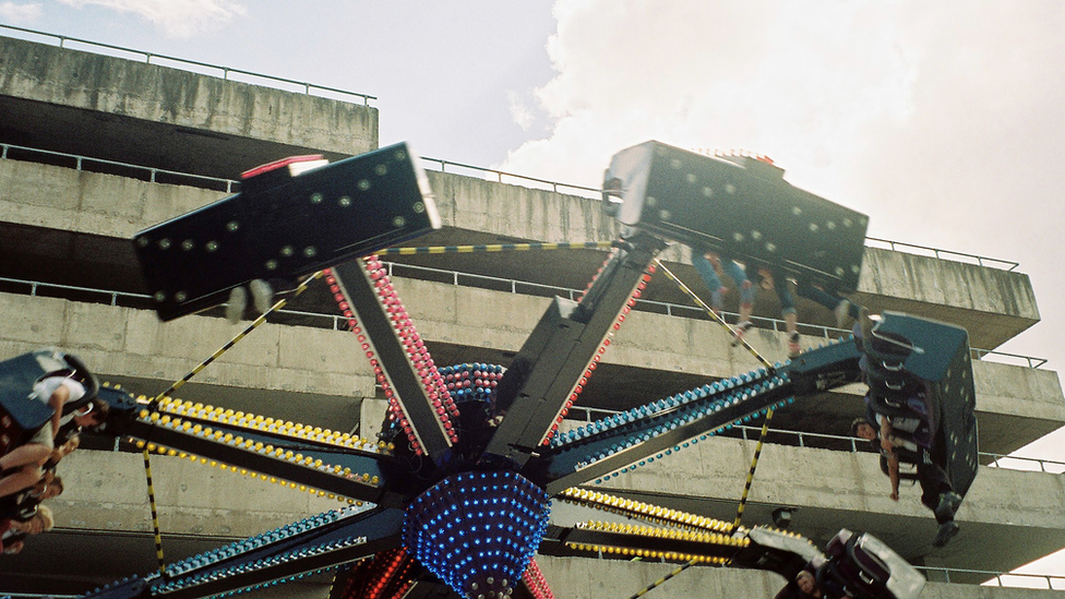 Fairground ride next to a Stourbridge multi-storey car park