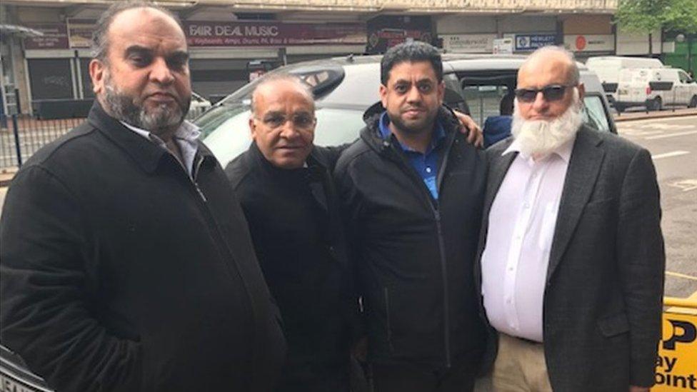 Raja Amin (second left) and Sajid Hussain (second right) with other drivers