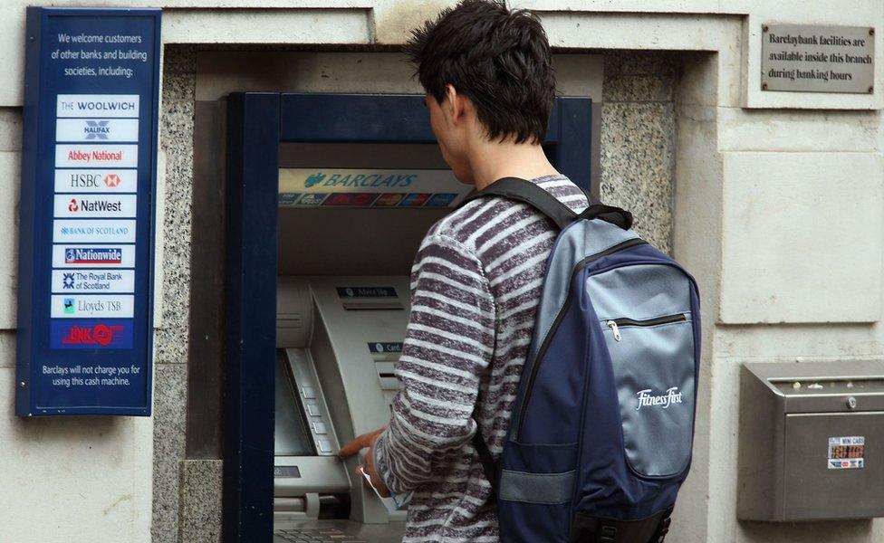 man at cashpoint