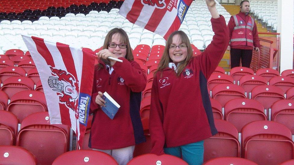 The girls at a Gloucester rugby game