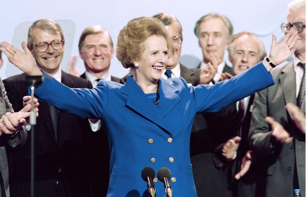 British Prime Minister Margaret Thatcher acknowledges applauds in October 1989 at the end of the Conservative Party conference in Blackpool