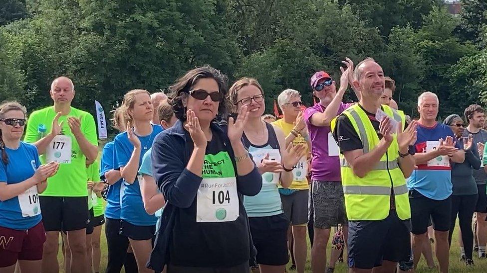 People applauding Harry Gration ahead of Jo Cox fun run