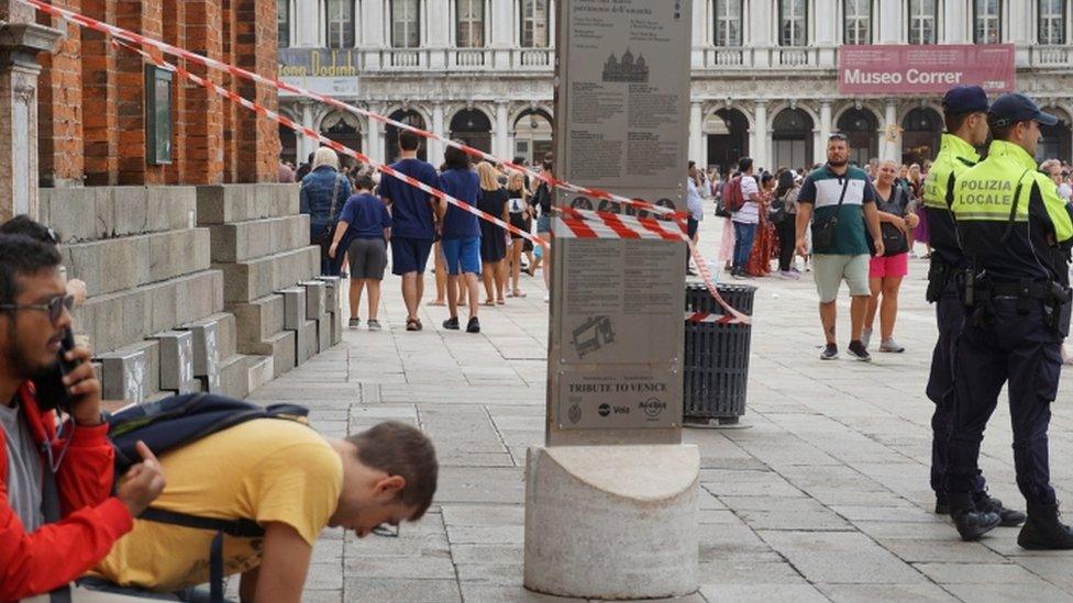 Police guard entrance to St Mark's belltower in Venice