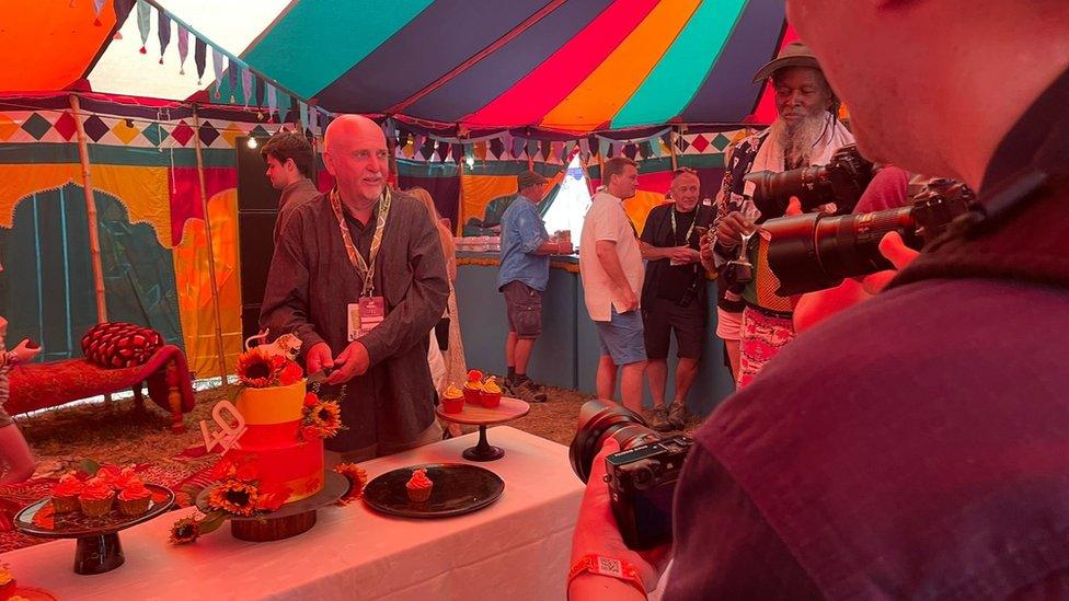 WOMAD co-founder Peter Gabriel cuts a 40th anniversary cake