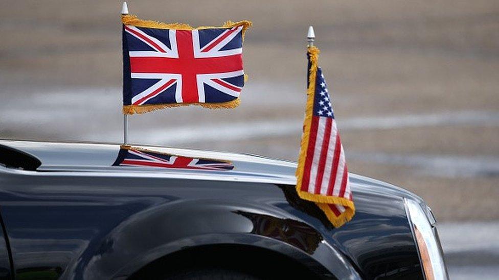 Car with UK and US flags