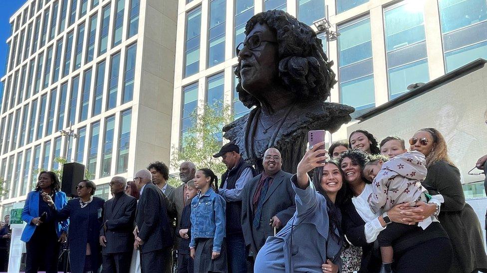 Betty's family with the statue