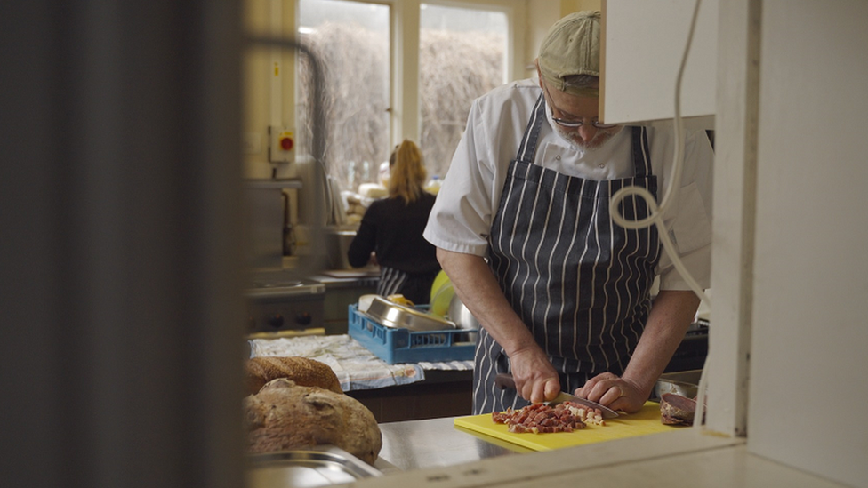 Man cooking meals for those in need