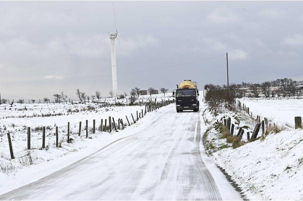 van on snowy road