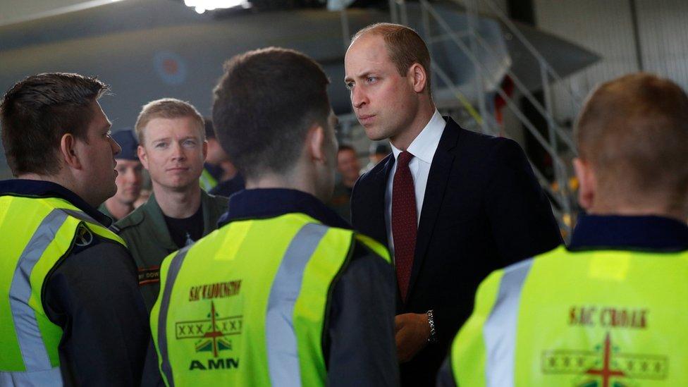 Prince William talking to engineers at the base