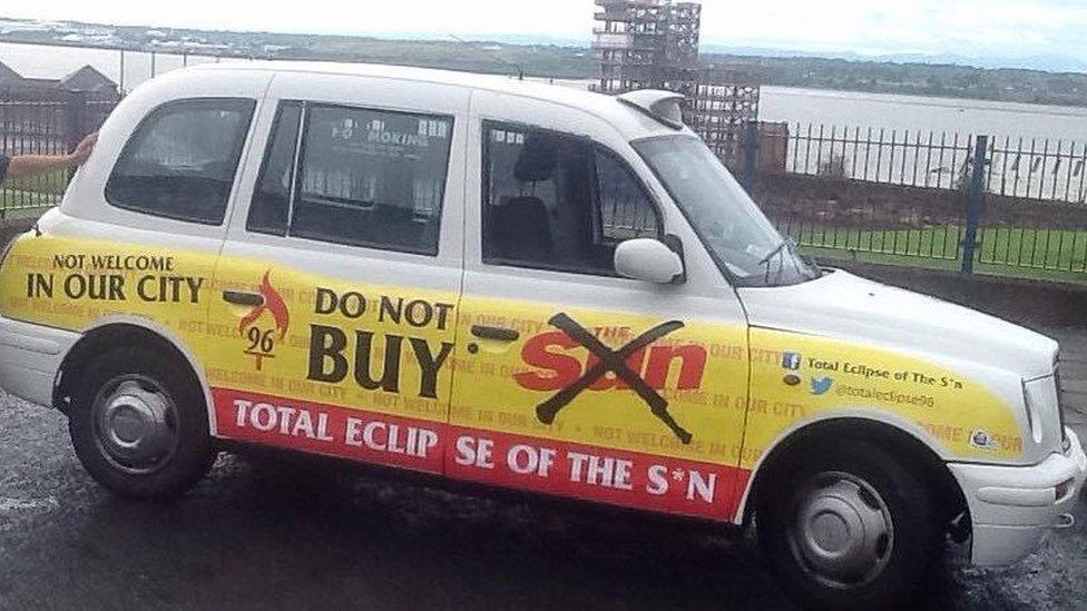 Taxi branded with a do not buy the sun message