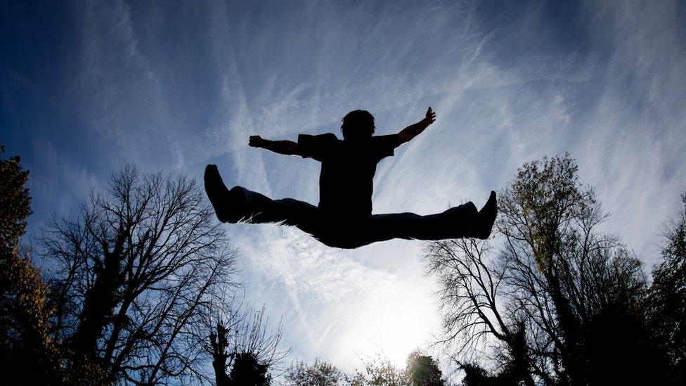 Silhouette of a man in the air