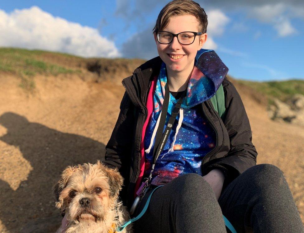 River Cartledge and assistance dog Chico