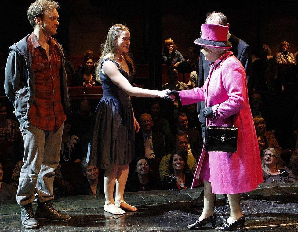 The Queen speaking to Romeo and Juliet actors Sam Troughton (left) and Mariah Gale during a visit to the Royal Shakespeare Theatre in 2011