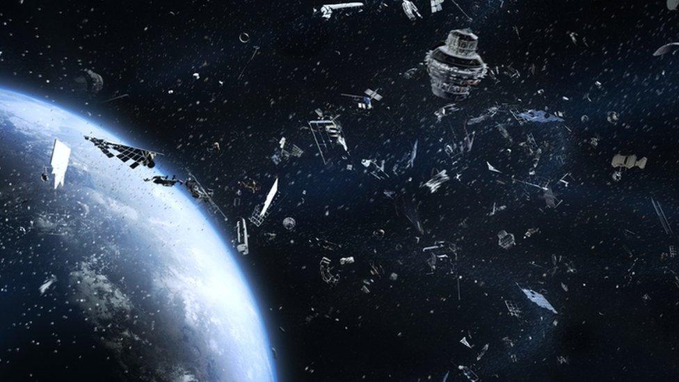 Space debris, animated image of earth surface in space with piece of rubbish around