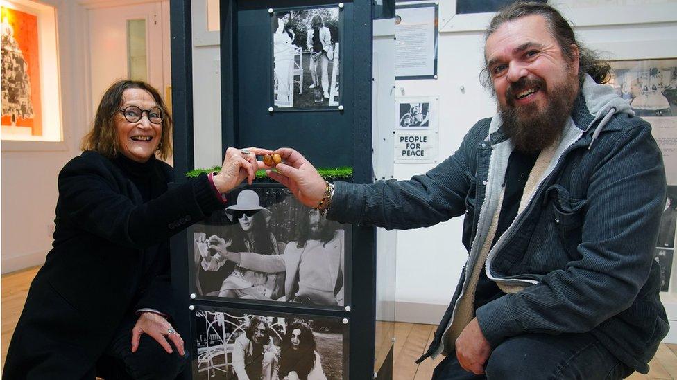 Julia Baird, sister of John Lennon and Roag Best, brother of former Beatles drummer Pete Best, with the two acorns that John Lennon and Yoko Ono planted at Coventry Cathederal