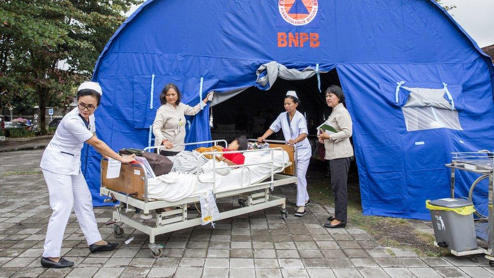 Hospital patients are moved to an emergency tent outside of a hospital building after an earthquake was felt in Denpasar, Bali, Indonesia, 06 August 2018