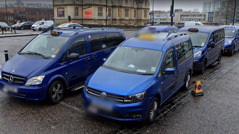 Bristol blue taxis lined up at Bristol Temple Meads