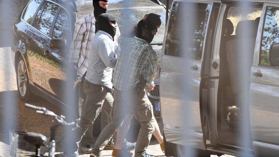 A man suspected of being an Islamic State (IS) militant arrives at the Federal Supreme Court in Karlsruhe, southern Germany, on 13 September 2016