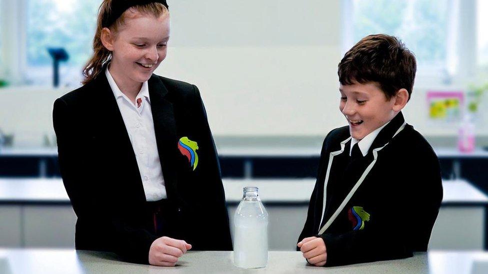 School pupils and a bottle