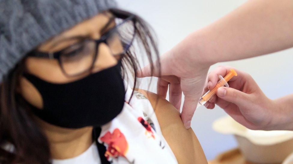 A woman receives a Covid vaccine at Elland Road in Leeds