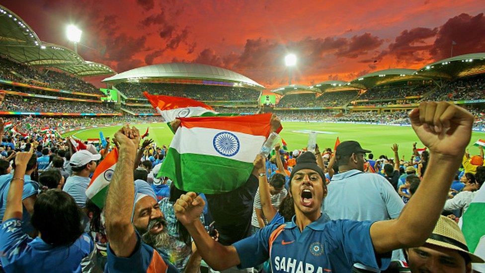 : A general view as Indian fans in the crowd celebrate as a Pakistan wicket falls during the 2015 ICC Cricket World Cup match between India and Pakistan at Adelaide Oval on February 15, 2015 in Adelaide, Australia.