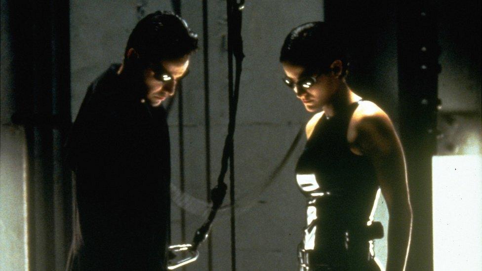 Keanu Reeves and Carrie-Anne Moss in The Matrix