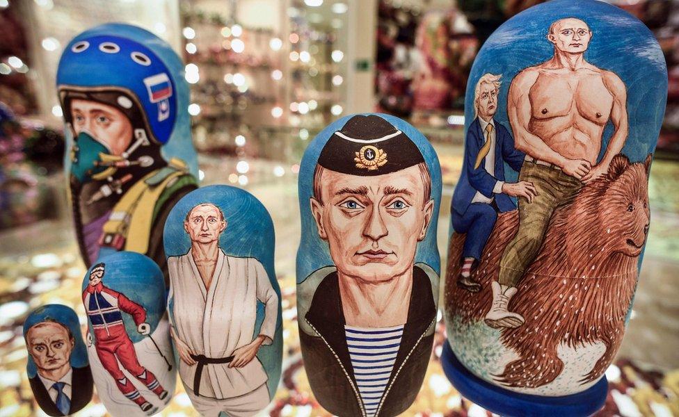 A picture shows traditional Russian wooden nesting dolls, Matryoshka dolls, depicting Russian President Vladimir Putin