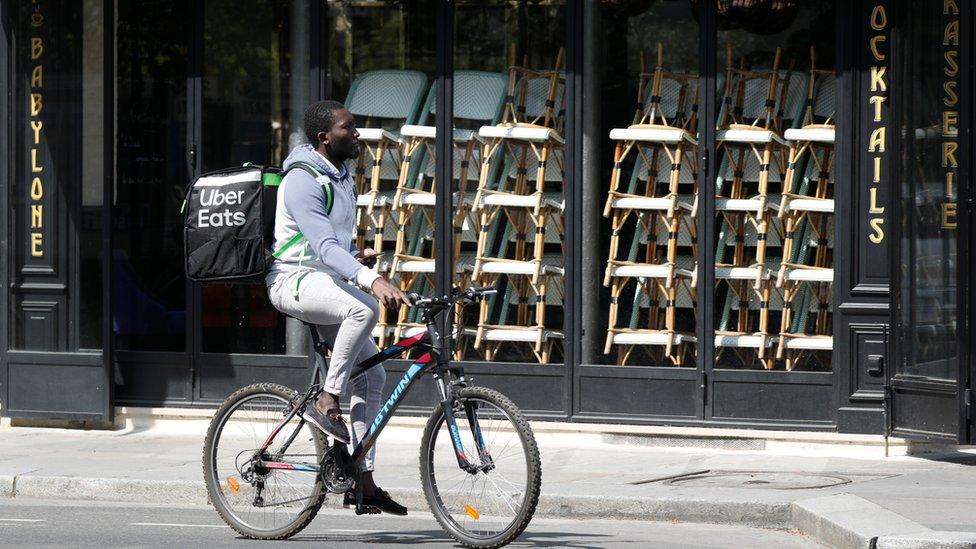 An Uber Eats cyclist in Paris in April