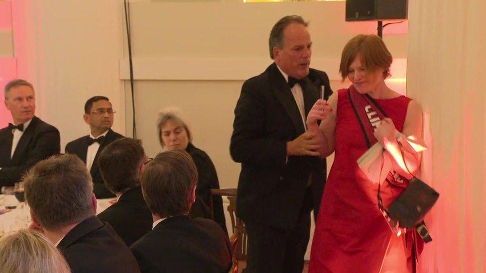 Mark Field tackling a protestor at Mansion House